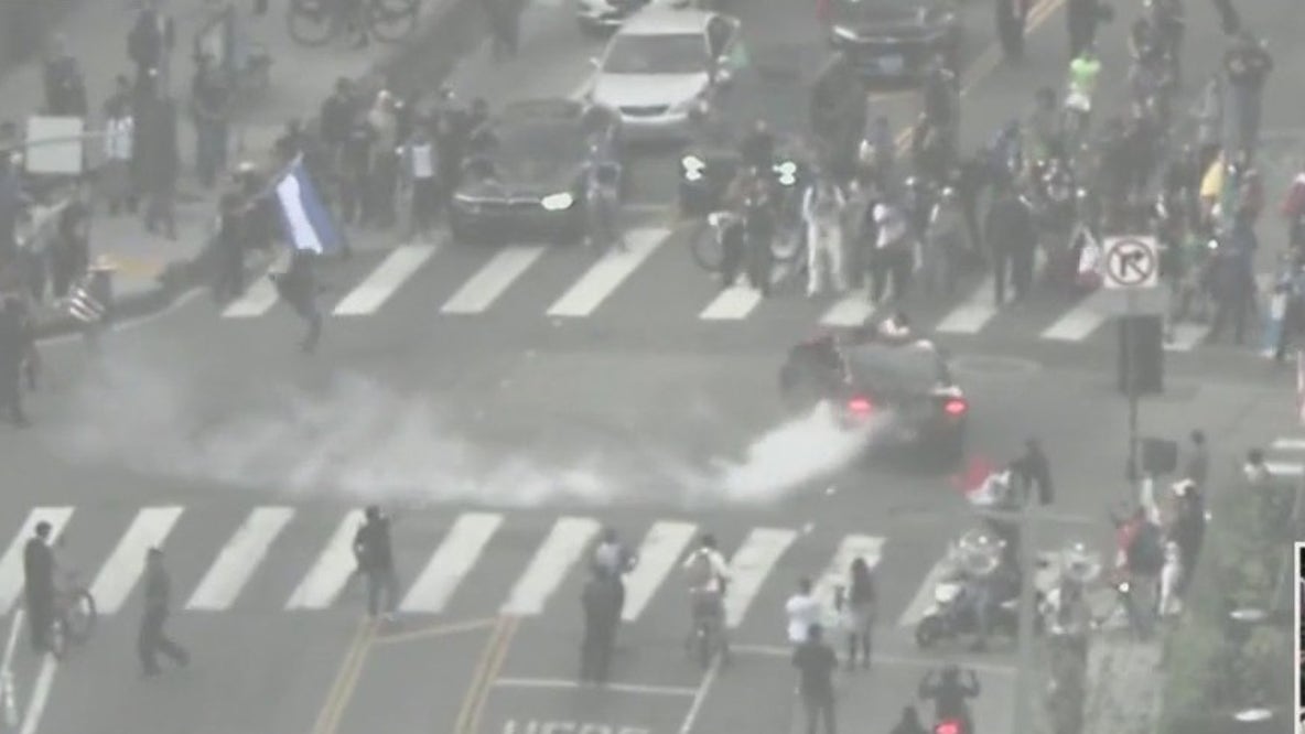 Car does donuts in DTLA intersection after protest