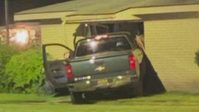 Truck crashes into Pontiac apartment, narrowly missing three children