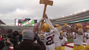 Gophers players celebrate taking Paul Bunyan's Axe