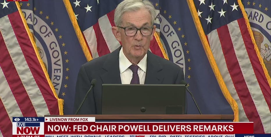 Fed cuts key interest rate, signals two more this year