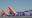 Southwest to start charging for checked bags