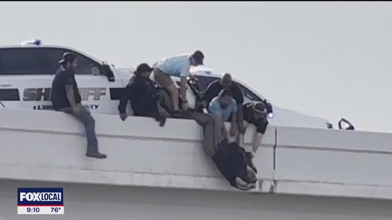 Lubbock bystanders rescue deputies pinned by patrol car after semi-truck collision