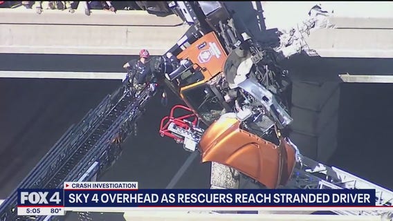 Tow truck hangs from overpass in Texas, driver rescued