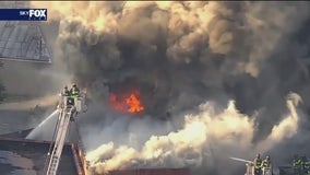 Fire erupts at Queens tire shop