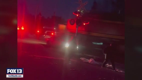 Freight train hits woman's car in Monroe, WA