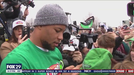 Saquon Barkley works shift at Raising Cane's day before Super Bowl parade