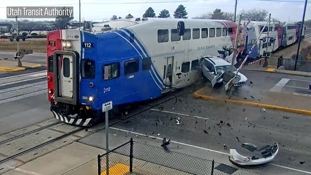 Video shows driver escape seconds before train smashes into SUV