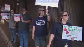 Aviation workers picket at Sky Harbor, working without pay during shutdown