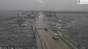 Hurricane Helene: Cars crossing Matlacha Bridge as waves crash onto street