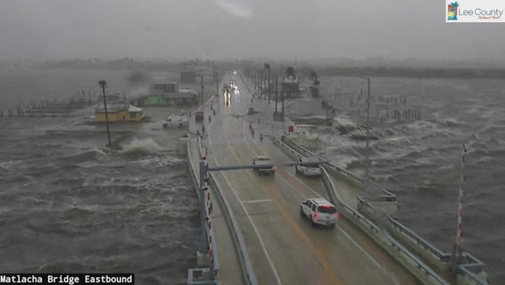 Hurricane Helene: Cars crossing Matlacha Bridge as waves crash onto street