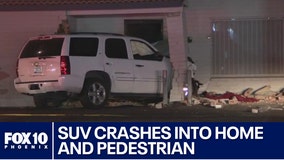 SUV crashes into a building at Indian School Road