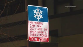 Hundreds of cars towed for violating Chicago's winter parking ban