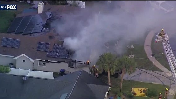 Firefighters battling house fire in Orange County
