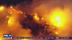 Massive fire tears through apartments in Camden County