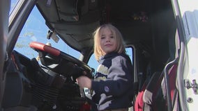 Kids tour Phoenix city trucks at local library