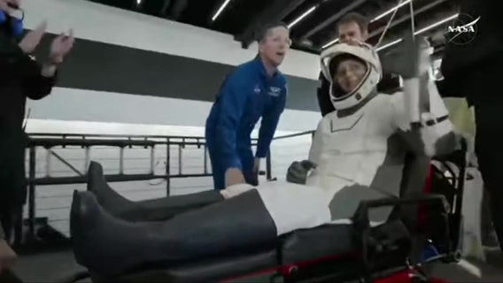 Stranded NASA astronauts smile, wave after emerging from SpaceX capsule