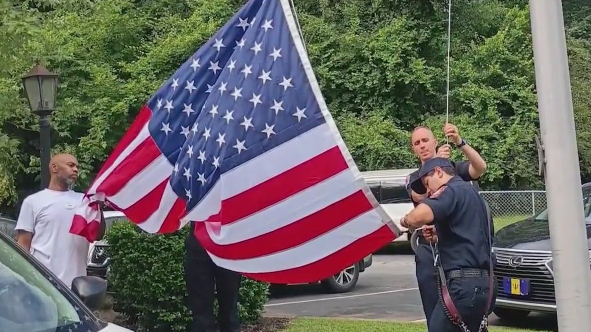 Firefighters fix broken flagpole at nursing home