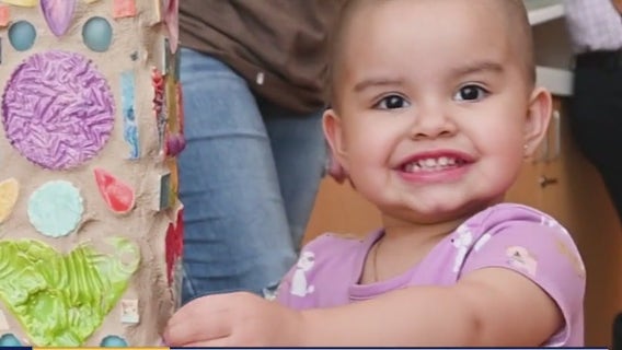 Child cancer patients ring bell celebrating being cancer free