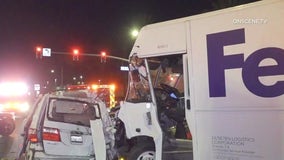 FedEx truck slams into several cars