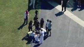 Cellphone video shows students hiding from shooter