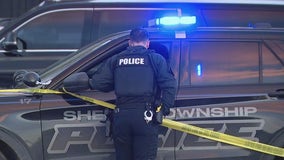 Two men shot dead at an auto shop, suspect search continues