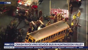 2 injured, including student after truck, school bus crash