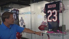 Lou Canellis walks through the Devin Hester and Steve McMichael's NFL Hall of Fame display
