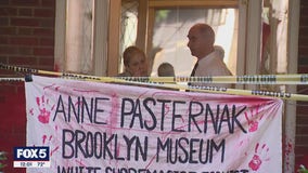 Demonstrators smear red paint on Upper East Side building