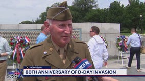 Bob Barnard speaks to a World War II veteran on the 80th anniversary of D-Day