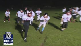 An undefeated East Bay youth football team credits its success to a beloved coach killed last year