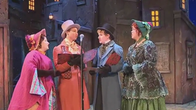 Carolers sing