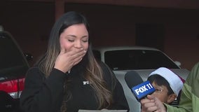 Family surprised with check at Operation Blue Santa