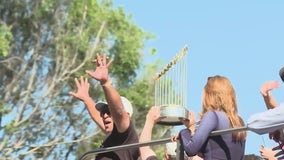 Dave Roberts shows off Commissioner's Trophy