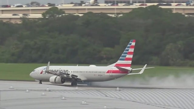 Video: Smoke seen shooting from plane at Tampa International Airport moments before take-off
