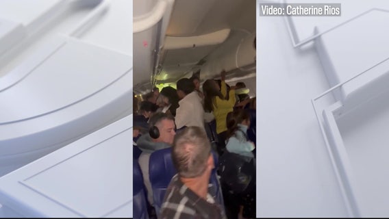 Two injured after cell phone battery sparks fire on Southwest flight in Denver