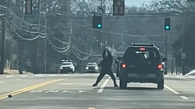 Apparent road-rage axe attack caught on camera; suspect on the run