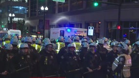 Protesters stand off with police during a rally outside of Chicago's Israeli Consulate