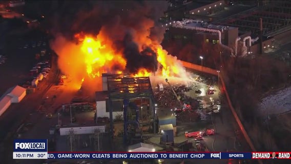 Massive junkyard fire under control and extinguished, officials say