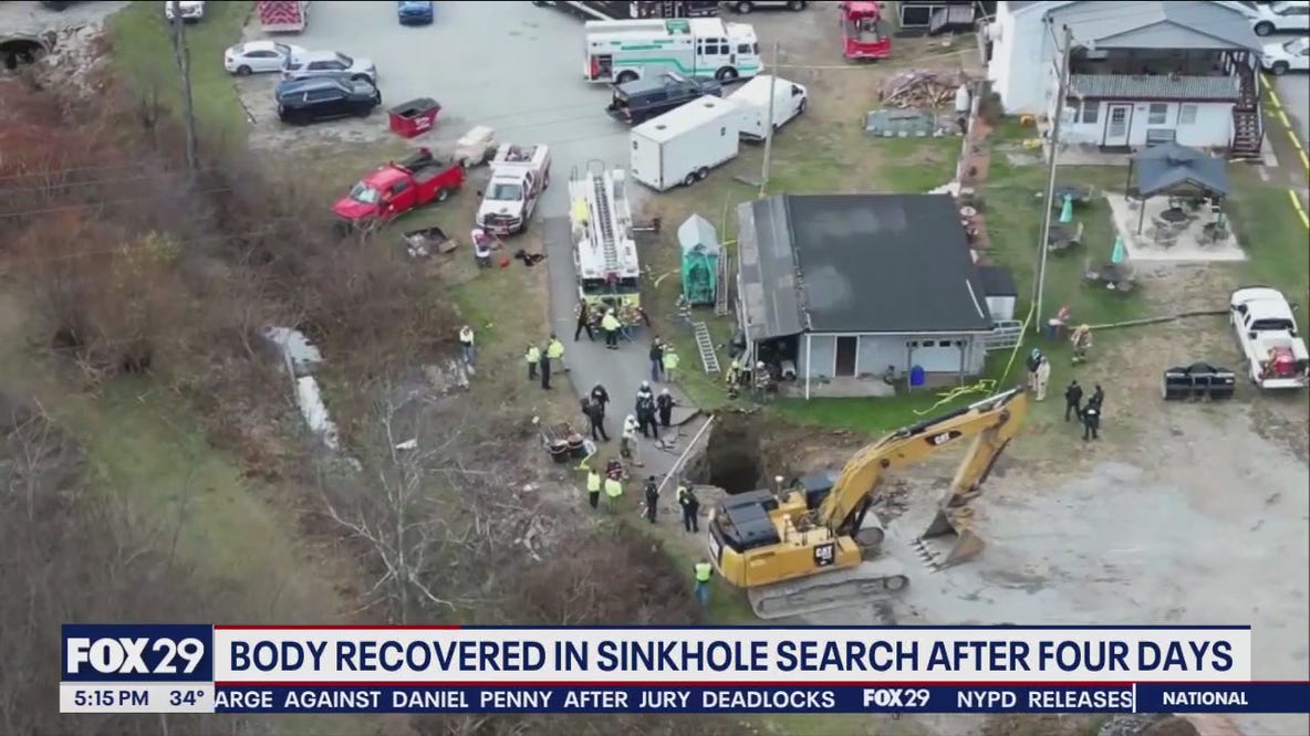 Crews recover body of woman who fell in sinkhole