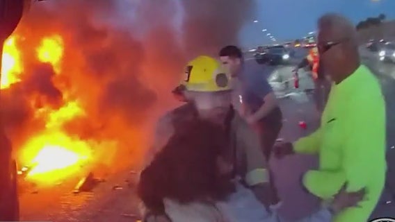 Heroes in action: 2 men save woman from burning car