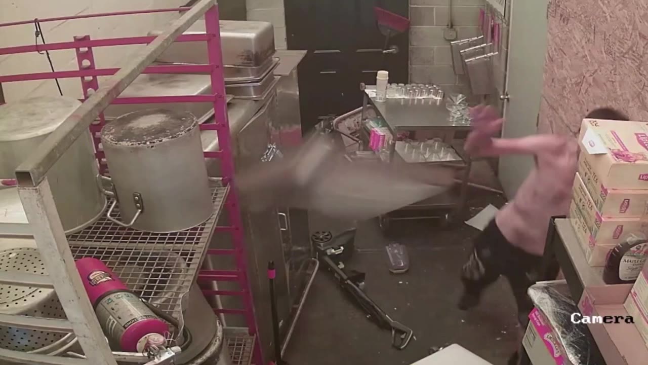 Shirtless man throws metal pan at security camera during destructive break-in of Philly catering business