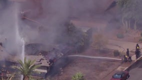 SWAT team surrounds burning home in Tempe