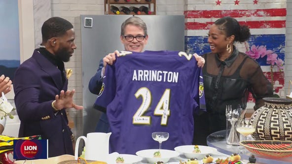 Super Bowl champ Kyle Arrington gives Tucker a Ravens jersey