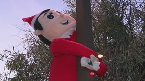 Giant elf in Gilbert spreads holiday cheers