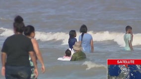 Residents enjoy beach despite Beryl approaching