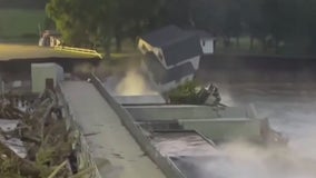 Family watches house fall into Blue Earth River