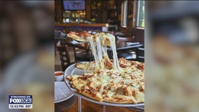 Have a slice of pizza at Moretti's restaurant