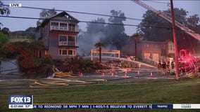 Crews battle house fire in South Seattle