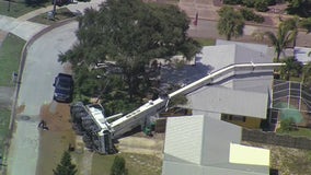 Crane collapses on home in Merritt Island