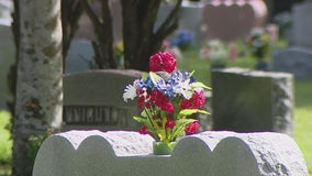 Army veteran cleans graves at cemetery